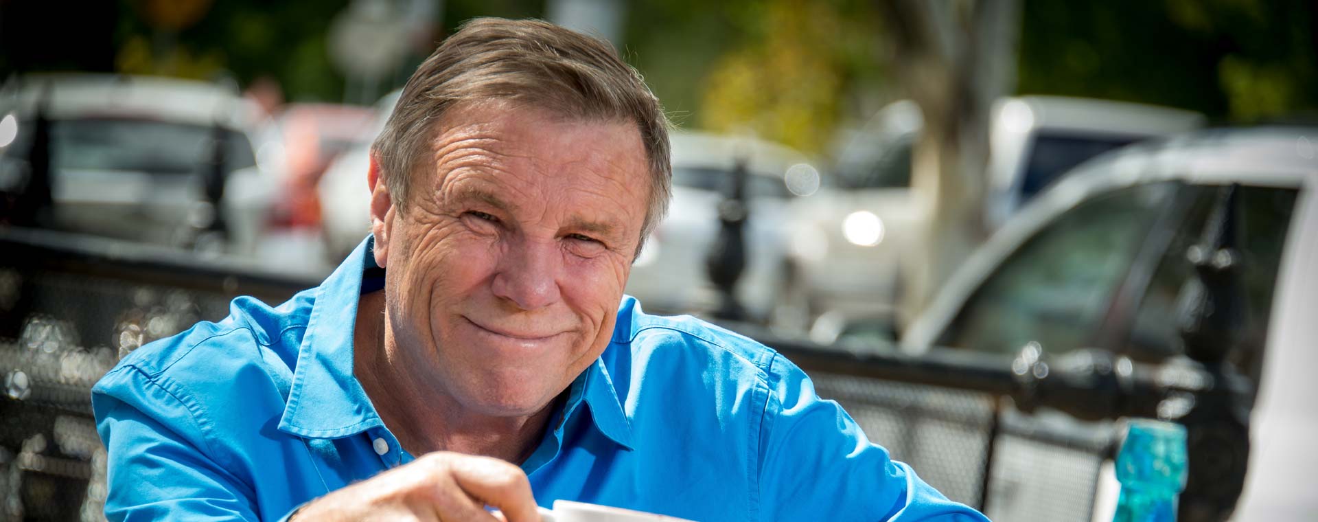 Charles Wooley enjoying a coffee.