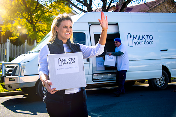 Woman making a home delivery of groceries